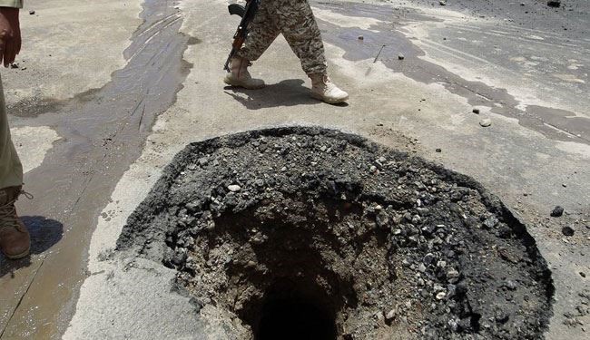 Yemeni soldiers inspect the damage done by air strikes of the Saudi-led coalition on the tarmac of the international airport of Sanaa on May 5, 2015.