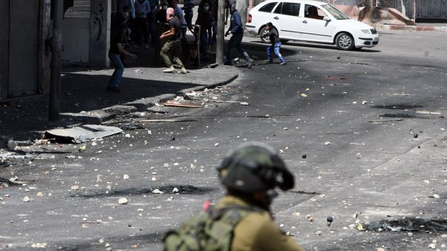 Clashes erupt between Israeli troops, Palestinian mourners in West Bank