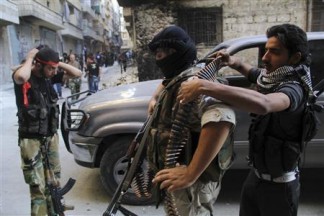 Free Syrian Army fighters prepare for an offensive against forces loyal to Syria's President Bashar al-Assad, in Aleppo's Salaheddine neighborhood