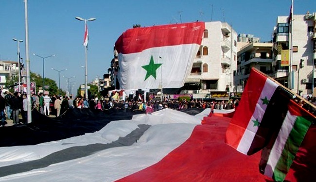 Syrians march in Latakia to support their national army