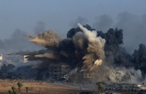 An explosion during an Israeli strike in the northern Gaza Strip is pictured from the Israeli border with Gaza, before a cease-fire takes effect