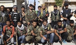 Kurdish fighters from the Popular Protection Units pose for a picture in Aleppo's Sheikh Maqsoud neighbourhood