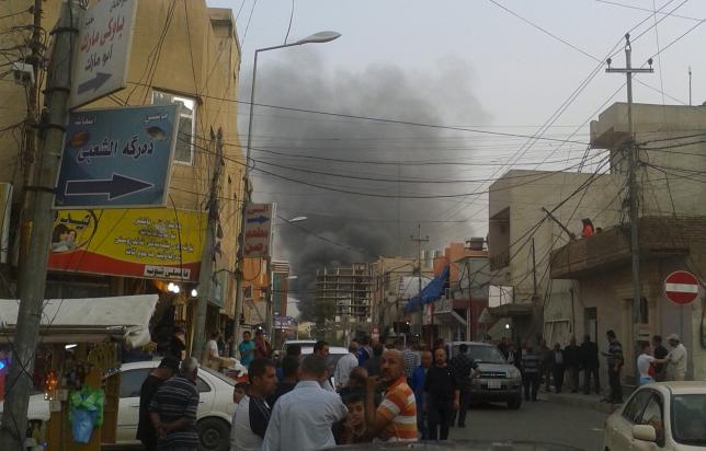Smoke rises from the site of a bomb attack in Erbil, the capital of Iraq's Kurdistan region